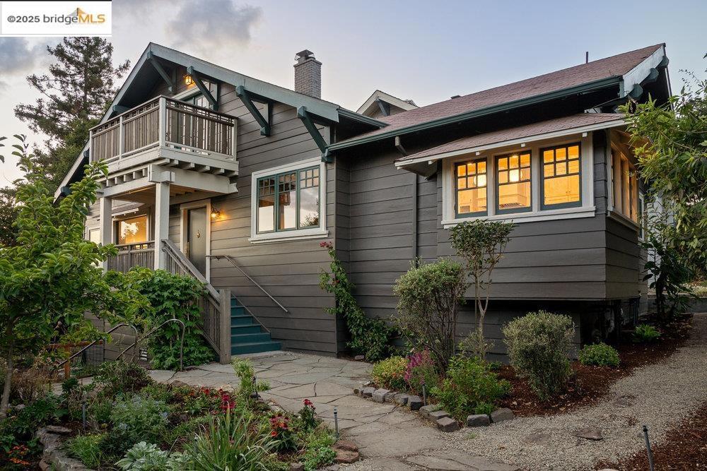 A beautifully revived 1912 Craftsman with farmhouse roots, 1178 Oxford Street is a magical Berkeley home with a story steeped in music and gardening. Set on nearly a quarter acre, it features rich wood detailing, multiple living spaces, and dramatic city and Bay views. The tiered gardens create a park-like setting that attracts birds and butterflies, offering serenity and inspiration. This 4-bed, 4-bath home balances original Craftsman charm with modern convenience. Highlights include a gourmet kitchen, formal dining room with built-ins and crown molding, redwood-lined studies, laundry room, in-law unit, and an attic ready for 500 sq. ft. of expansion. Upstairs, a vaulted, light-filled room opens to a balcony with sweeping views of the city and both bridges—perfect for enjoying incredible sunrises and sunsets. The slate patios and gardens invite you to extend your living space outdoors, create a retreat among redwoods and oaks, or even add a greenhouse, cabin, or ADU. Located in the lively and artistic North Berkeley neighborhood with incredible proximity to all things Berkeley including UC Berkeley, The Rose Garden, Live Oak Park, Solano Ave, Tilden Park, and some of the city’s best dining. This home blends historic elegance and breathtaking views into one timeless package. Views: Downtown
