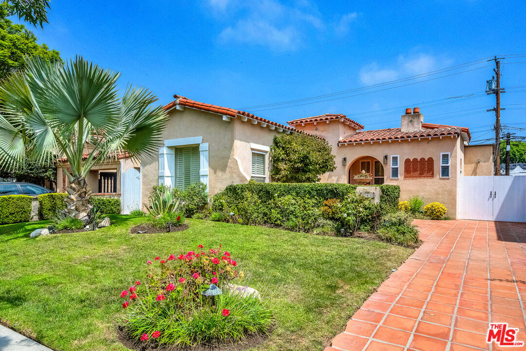 This enchanting 1929 Spanish-style residence sits on a picturesque, tree-lined street in Beverly Hills. Lovingly maintained and thoughtfully updated, the home preserves its original character while providing modern comfort.Inside, you'll find a light-filled living room with dramatic exposed wood-beam ceilings, hardwood floors, and classic architectural details. The formal dining room flows into a spacious kitchen with abundant cabinetry, a center island, and a breakfast area perfect for gatherings and everyday living.The home offers 4 bedrooms and 3 bathrooms. The 4th bedroom is currently configured as a media room/lounge area but can easily be converted back into a bedroom if desired. The primary suite includes generous closet space and a private retreat.Outdoors, enjoy a front courtyard, lush landscaping, and a private backyard with grassy areas, fruit trees, and a tiled patio for dining al fresco. The garage is currently used for storage and not suitable for cars, but the driveway provides parking for up to 3 - 4 vehicles.Located in the highly sought-after Beverly Hills school district and within walking distance to prime restaurants and shops on Robertson Blvd, this timeless Spanish residence offers character, convenience, and an unbeatable location.Available now for lease, equipped with essential furniture or unfurnished.