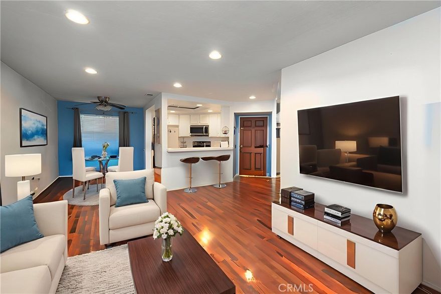 HUGE PRICE REDUCTION!!  Rancho San Diego:  Spring Valley Ranchwood community! Best deal in the area! Level entry into an inviting two-bedroom, one-bath unit features laminate floors and recessed lighting throughout. IN UNIT LAUNDRY! Kitchen with an eat-in area, private balcony—perfect for morning coffee or evening relaxation. Entry-level access from parking ensure ease of living with no stairs to navigate. The well-maintained complex offers fantastic amenities, including a pool, spa, tennis court, and BBQ park area. First-time homebuyers Down (payment assistance available) or investors seeking positive cash flow. Easy access to 54, 94  and 125. Don’t miss out on this wonderful opportunity! FHA/VA APPROVED!