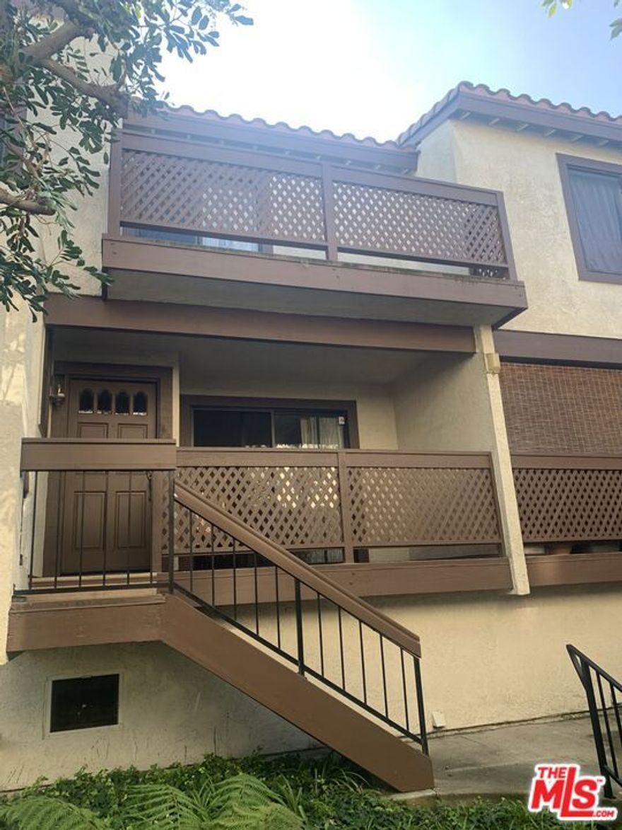 Opportunity to own in a private, gated community in Torrance. Ideally located near South Bay shopping, dining, and entertainment, this 2-bedroom, 2.5 bath townhouse is offered for the first time by the estate of the original owner. The home features mostly original finishes and presents a great opportunity for a buyer with vision to update and personalize. The main living level, located above the garage, offers a living room with fireplace and access to a private balcony, along with an open dining area and kitchen. The upper level includes a spacious primary suite with vaulted ceilings, walk-in closet, full bath with separate shower stall, and a private balcony. A second bedroom and a full hallway bath complete this level. The lower level features a large direct-access two-car garage with laundry area. HOA amenities include an enclosed pool and spa, as well as Frontier internet and cable service.