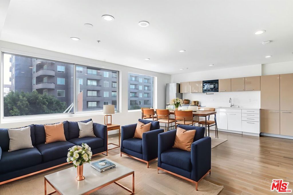 Welcome to Concerto Lofts, Unit 408, an exquisite residence in the center of the downtown. This modern 1-bedroom, 1-bathroom condo spans 920 square feet and boasts a walk-in closet and a gorgeous view of the city. The open floor plan, which features hardwood floors, is ideal for entertaining and offers ample storage throughout. Enjoy the convenience of an in-unit washer and dryer, 1 deeded parking space, and guest parking. Residents have access to luxurious amenities, including a saltwater pool and spa, a fitness center, a co-working space, and a dog park. Concerto Loft owners enjoy some some of the lowest monthly HOA fees in the area and the building is conveniently located near a variety of grocery, shopping, dining, and entertainment options.