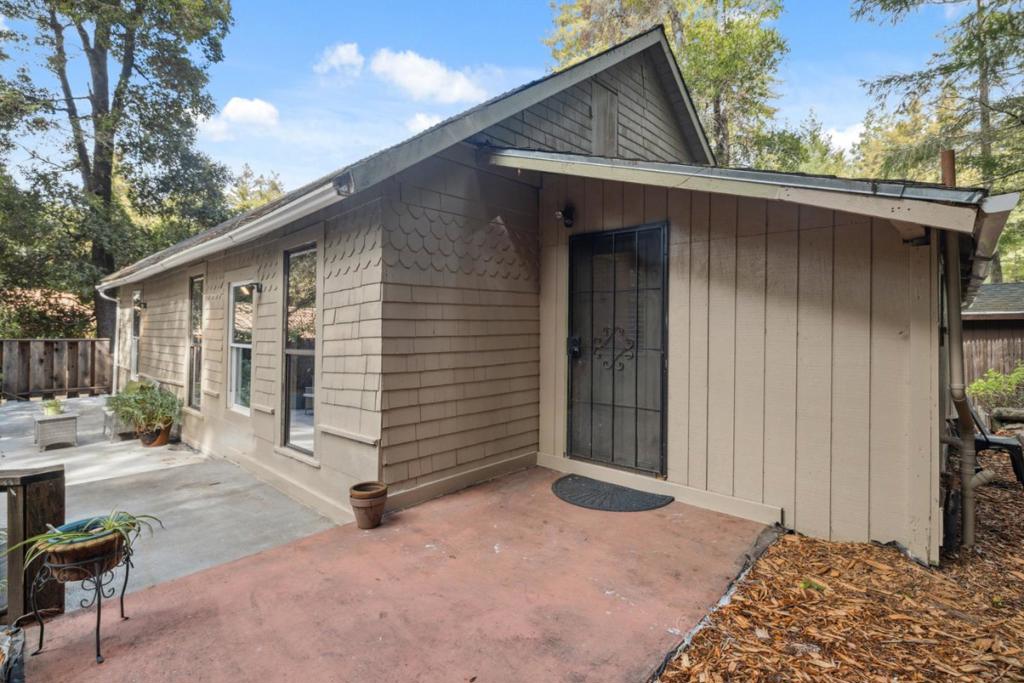 Located just behind the historic Brookdale Lodge, this charming 3-bedroom, 1-bath home offers a warm and inviting retreat. The kitchen features a newly installed gas oven, while hardwood floors add timeless character throughout. The downstairs space presents an exciting opportunityconvert it into a studio unit for additional income or provide a private haven for long-term guests. Outside, the spacious wrap-around deck is perfect for hosting lively BBQs or simply relaxing as you take in the serene beauty of the surrounding redwood forest. Conveniently located between downtown Ben Lomond and downtown Felton, you'll enjoy easy access to popular spots like Aroma Restaurant, Emerald Mallard and Mountain Feed and Supply.