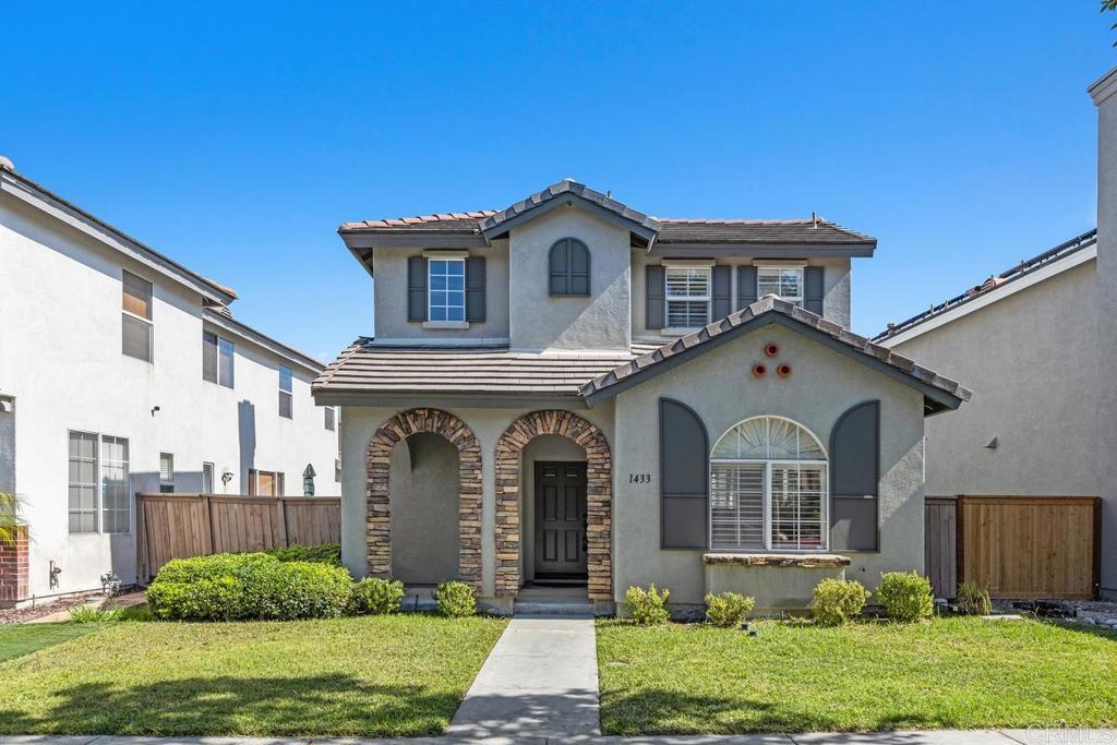 1433 Vallejo Mills is located in Hillsborough at Otay Ranch, and offers the comforts of a close-knit community highlighted with tree-lined streets, a community park with pool, playground & sand volleyball, and alley-loaded garages. The charming exterior of the house is clad in stone arches and window shutters and has a front porch overlooking a grassy lawn. The interior includes an extra-large kitchen with a newly-installed Frigidaire refrigerator, ample storage & cabinetry & faces out to the street. An open floor plan joins the entry foyer and staircase to the dining room and living room. The living room has a fireplace with a gas starter, a built-in wall entertainment cabinet, and direct access to the 2-car garage. The dining room is adjacent to the kitchen pass-through wall and has direct access through the sliding glass doors to the private backyard. At the base of the stairs is a guest bathroom. The second story houses all 3 bedrooms. The laundry room at the top of the stairs has a newly installed Maytag washer and Maytag dryer. Large primary bedroom with ensuite bath, and 2 additional bedrooms complete the floor. Hard surface wood flooring upstairs and on stairs, shutter window coverings throughout. Convenient access to the 125 tollway, Otay Ranch Town Center, and a myriad of outdoor activities at Otay Lake parks. Otay Ranch is a very attractive community, and 1433 Vallejo Mills is a great choice for your next home.