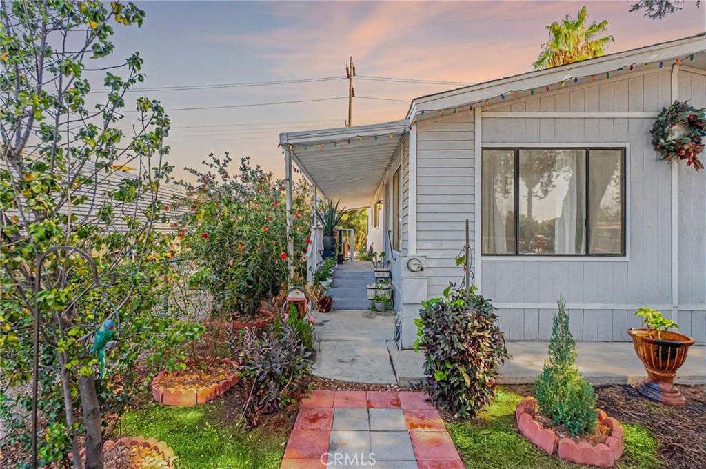 This beautifully remodeled manufactured home offers a comfortable and modern single-story layout featuring 3 bedrooms and 2 full bathrooms, 1,344 square feet. The interior spacious highlighted by a kitchen with plenty of cabinets and elegant countertops. For year-round comfort, includes a convenient inside laundry area. The exterior boasts attractive curb appeal with brick/iron fence in the front, well-maintained mature landscaping, a charming walkway, and a partially covered patio area, making it a fantastic and move-in-ready opportunity.