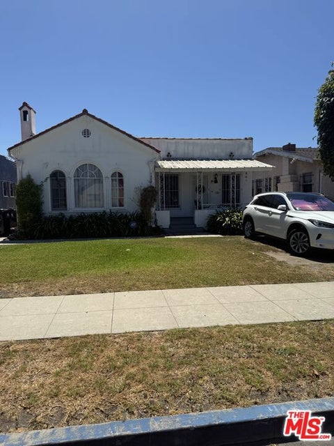 Photo of 1922 W 39th Place, Los Angeles, CA 90062 (MLS # 26874695)