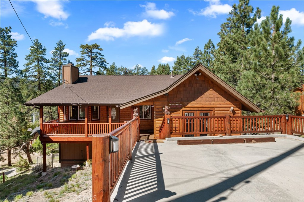 Don’t miss this rare opportunity to own a newer custom-built mountain home in Big Bear Lake! Built in 2004 and beautifully maintained, this 4-bedroom, 3-bath home features soaring vaulted ceilings, exposed timber beams, and beautiful upgraded laminate flooring throughout. The open-concept living room flows seamlessly into the kitchen and dining area, creating a warm and inviting space perfect for entertaining. From the dining area, step out onto a large elevated deck with panoramic, unobstructed views of the surrounding trees and hills.
One of the bedrooms is approximately 400 sq ft, complete with an en-suite bath and a private exterior entrance—ideal for guests, short-term rental income, or extended family. Downstairs, a nearly full-size unfinished basement with a separate entrance offers endless potential for customization—think ADU, game room, workshop, or additional living space.
In addition to the main living space, the home includes a nearly full-size unfinished basement area with a separate exterior entrance, offering endless possibilities for expansion—ADU, game room, workshop, or additional living space.