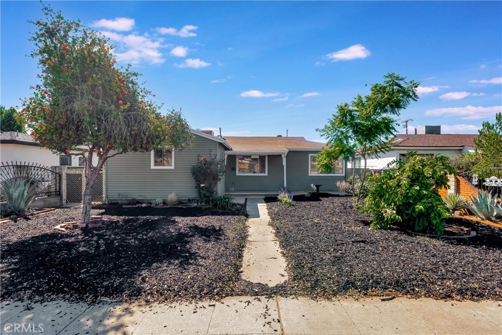 Versatile single-story, 4 bed, 2 bath, Southern California rambler with separate, fully permitted 1 bed, 1 bath ADU in a commuter friendly location within the City of San Fernando. Refreshed with new flooring and fresh paint inside and out, this home boasts abundant natural light, mature fruit trees, and pollinator friendly landscaping. From the entryway step directly into a large and airy dining and living area perfect for hosting! The sizable kitchen features new tile floors, quartz counters, original oak cabinets, stackable laundry hookups, and space for a breakfast nook. The home's efficient layout includes four good-sized bedrooms, each with new flooring and ceiling fans. Situated just across the hall are two baths, one full, one ¾, both recently refreshed! An ample paved back patio creates the perfect space for relaxing or entertaining all while providing a clear demarcation between the main home and ADU. The fully permitted ADU with its own address, 11021, sits at a lower level than the main house, has a separate electric meter, its own HVAC, and enjoys private entry from the back alley. Inside, the space’s modern and comfortable design features a spacious living room and a kitchen area with butcher block countertops, Shaker cabinets, stainless-steel appliances, and laundry hookups. The bedroom offers a contemporary ceiling fan, recessed lighting, and an en-suite ¾ bath. Off the living spaces is a private, covered patio perfect for cookouts or just unwinding. Whether you’re looking for multi-generational living, rental income, or simply room to grow, this property checks all the boxes. Well situated near schools, dining, and with easy access to 405, 5, and 118 freeways, this is an opportunity not to be missed!