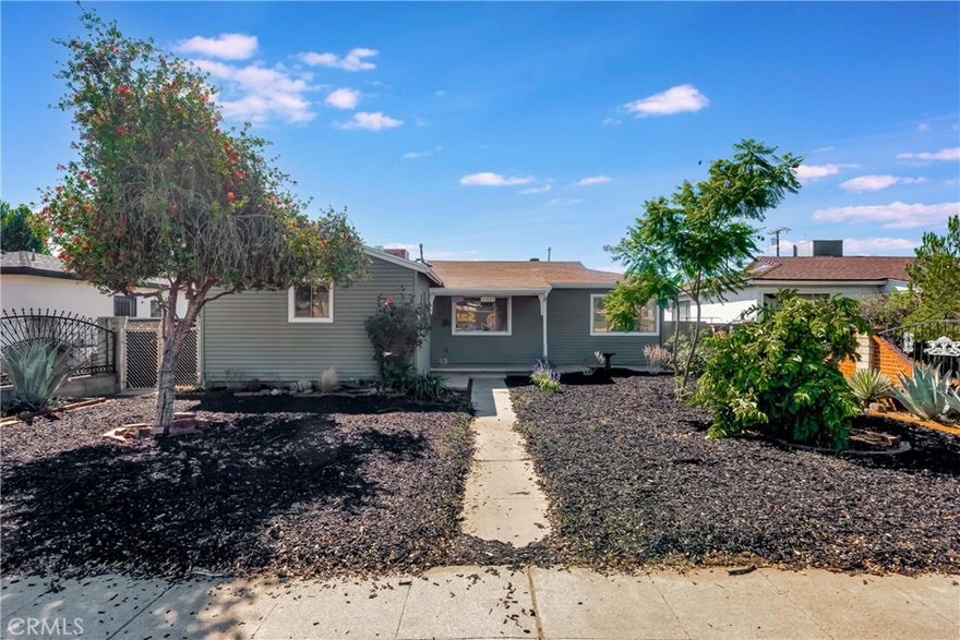Versatile single-story, 4 bed, 2 bath, Southern California rambler with separate, fully permitted 1 bed, 1 bath ADU in a commuter friendly location within the City of San Fernando.  Refreshed with new flooring and fresh paint inside and out, this home boasts abundant natural light, mature fruit trees, and pollinator friendly landscaping.  From the entryway step directly into a large and airy dining and living area perfect for hosting! The sizable kitchen features new tile floors, quartz counters, original oak cabinets, stackable laundry hookups, and space for a breakfast nook. The home's efficient layout includes four good-sized bedrooms, each with new flooring and ceiling fans. Situated just across the hall are two baths, one full, one ¾, both recently refreshed!  An ample paved back patio creates the perfect space for relaxing or entertaining all while providing a clear demarcation between the main home and ADU. The fully permitted ADU with its own address, 11021, sits at a lower level than the main house, has a separate electric meter, its own HVAC, and enjoys private entry from the back alley.  Inside, the space’s modern and comfortable design features a spacious living room and a kitchen area with butcher block countertops, Shaker cabinets, stainless-steel appliances, and laundry hookups.  The bedroom offers a contemporary ceiling fan, recessed lighting, and an en-suite ¾ bath.  Off the living spaces is a private, covered patio perfect for cookouts or just unwinding.  Whether you’re looking for multi-generational living, rental income, or simply room to grow, this property checks all the boxes. Well situated near schools, dining, and with easy access to 405, 5, and 118 freeways, this is an opportunity not to be missed!