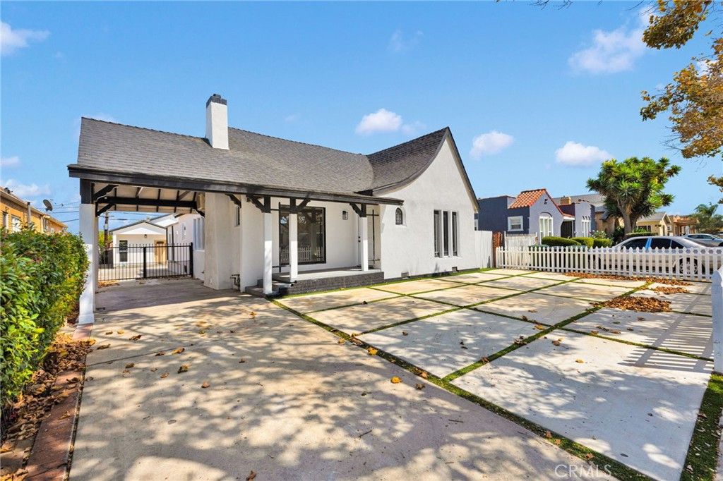 Photo of 8704 S Denker Avenue, Los Angeles, CA 90047 (MLS # IV25198143)