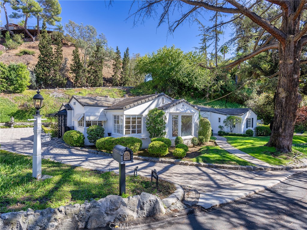 Welcome to a true character home filled with warmth, history, and timeless appeal. Lovingly maintained by the same family for over six decades, this rare gem is nestled on an enormous 20,880 square foot lot, offering space, privacy, and endless possibilities. Boasting 2,264 square feet of living space, this 3-bedroom, 2-bathroom residence is where dreams come true. From the moment you step into the formal entryway, you’ll be captivated by the classic details that set this home apart. The living room with a cozy fireplace, the den with vaulted ceiling and second fireplace, and the oversized formal dining room create an elegant and welcoming atmosphere for both everyday living and entertaining. Gorgeous parquet flooring, central heat and air, and a kitchen with charming breakfast nook provide comfort and convenience, while the dedicated laundry room, patio, and mountain views add to the appeal. The detached 2-car garage and expansive grounds offer plenty of space for gardening, play, or future expansion. With too many features to list, this is truly a must-see home located in a fantastic neighborhood. Don’t miss this once-in-a-lifetime opportunity to own a piece of history and create your own legacy in a home that’s been cherished for generations.