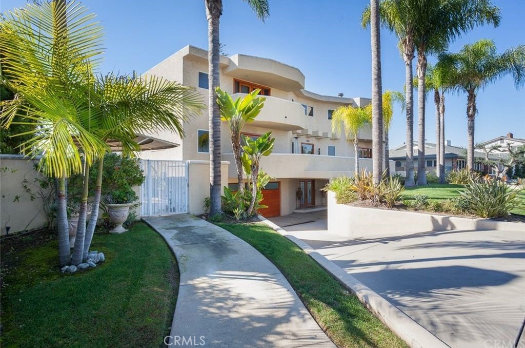 Discover the epitome of Newport Beach living. Enjoy unobstructed panoramic Back Bay views and city lights with resort-style living from this custom home located in Newport Beach. From the green expanse of lawn, swaying palms and circular motor court leading to four semi-subterranean parking spaces, this contemporary Mediterranean home immediately impresses. The entryway opens to a dramatic two-story foyer with white Chrystal chandelier. It features multiple terraces, 4,300+ sq. ft. of interior open flow living space, 4 bedrooms, 3 bathrooms and a wine cellar. The remodeled gourmet kitchen has Thermador professional-grade stainless appliances; open to the great room which is ideal for entertaining with a large wrap around bar area. A resort-style backyard boasting a saltwater pool with bridge, Jacuzzi and waterfall, along with an outdoor fire-pit, BBQ island and Cabana emulates a tropical Oasis. This luxury home is walking distance to the Back Bay and is in close proximity to world-class beaches, the best of Newport dining, Fashion Island, nature reserve, golf courses, John Wayne airport, and much more.