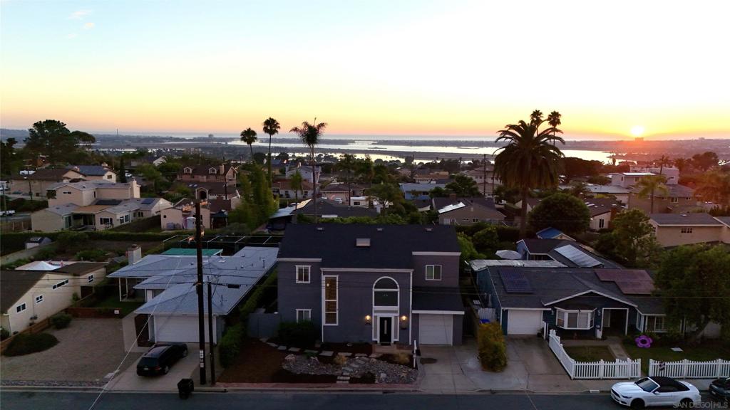 Get ready to enjoy SUNSETS, FIREWORK shows and POOL sessions at this beautiful Bay Park property. This spacious 5 bedroom, 3 bath home features OWNED SOLAR, newer HVAC & roof, NEW PATIO, pool coping and drain lines, flooring and paint. Natural light floods the double height entry and living room and an open floor plan keeps everyone connected. The second floor master has a wonderful deck, perfect for taking in the San Diego Bay views. On-suite features a jetted tub and vintage tile. An external spiral staircase makes sure everyone can enjoy the views without trekking through a bedroom! All of this, located minutes from the freeway, SeaWorld, beaches, and the bay. Come see for yourself today!