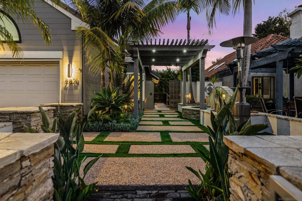 Welcome to 2821 Forest View Way, an exquisite property located in the heart of Carlsbad, CA. This stunning home has been extensively renovated with no expense spared - new windows, engineered hardwood flooring, chefs kitchen, luxury bathrooms, automatic child-safe pool and spa cover, smart features including ring doorbell, dual floodlight cams, ecobee thermostat, myq garage opener and keypad, HVAC system, water heater. Offering 2430 square feet of beautifully designed living space, the residence boasts four bedrooms and three bathrooms, meticulously crafted with high-end finishes and amenities inside & out. The large kitchen is a chef's dream equipped with sub-zero, and wolf appliances - ample counter space, and full kitchen island with bar seating. With its wide open floor plan, this home is perfect for entertaining, and everyday family living. Natural light pours into every room through sleek modern windows. High ceilings add to the sense of openness and grandeur throughout this home. Luxurious bathrooms feature frameless glass showers, backlit mirrors, and dual vanities, offering a spa-like feel. You'll appreciate the convenience of a full sized, side-by-side washer and dryer. Step outside to find your own private oasis complete with a pool, gas-lined fireplace with built-in seating, outdoor bar and kitchen. This property boasts a secondary entertainment/living room providing additional space for leisure activities or relaxation.