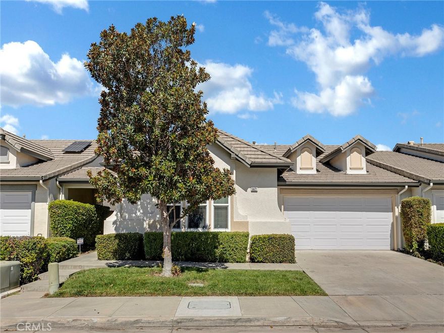 Welcome to this beautifully maintained single-story home nestled in the highly sought-after Casa Flores 55+ gated community. This inviting residence showcases a bright, open-concept layout with high ceilings, abundant natural light, and an effortless flow between the living and dining areas—perfect for both everyday living and entertaining. The well-appointed kitchen features elegant granite countertops, updated cabinetry, and a large stainless steel sink, creating a stylish and functional space for any home chef. The spacious primary suite provides a serene retreat, featuring a vaulted ceiling, dual sinks, and a private sliding glass door that opens to the patio—perfect for enjoying morning coffee or evening relaxation. Both bedrooms feature rich wood laminate flooring and ceiling fans, blending comfort with contemporary design. Step outside to a peaceful, low-maintenance backyard highlighted by charming planters and flowerbeds, offering the perfect balance of beauty and simplicity. Residents of Casa Flores enjoy resort-style amenities, including manicured grounds, a sparkling pool, a relaxing spa, and a community park with picnic areas. Additional features include central air and heat, dual-pane windows, an indoor laundry area, and direct access to an attached two-car garage. Conveniently located near shopping, dining, healthcare, parks, and the 118 Freeway, this home combines comfort, convenience, and an active lifestyle in one of East Simi Valley’s most desirable 55+ communities.  Don’t miss this exceptional opportunity to make Casa Flores your new home!