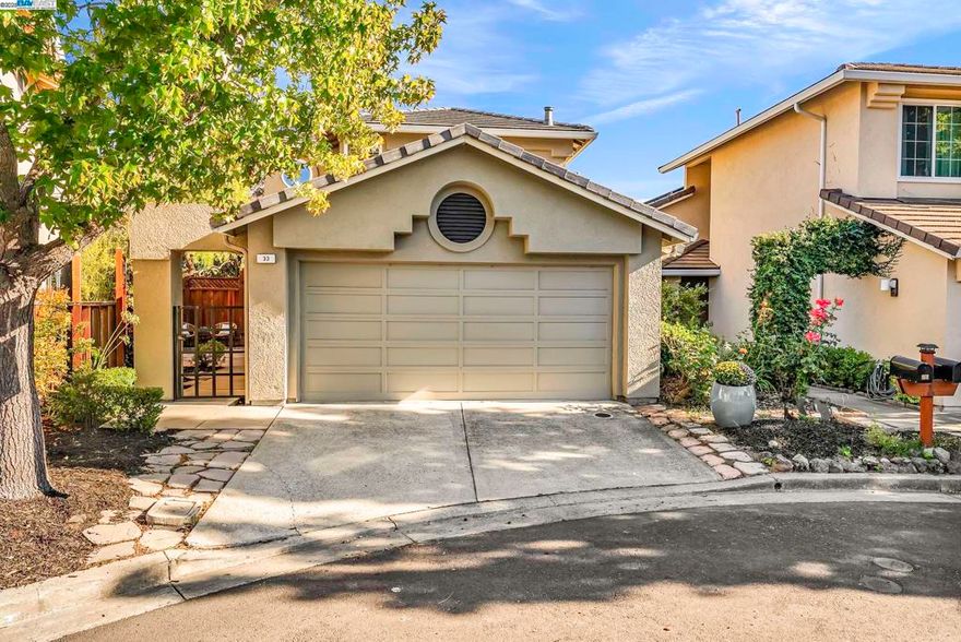 Welcome to your serene oasis in the highly sought-after Canyon Lakes gated community of San Ramon! Nestled on a quiet court, this stunning single-family home combines comfort, style, & resort-like amenities. Step inside to soaring ceilings, a cozy fireplace, & an inviting living room, dining room combo area filled with natural light. The beautifully updated eat-in kitchen boasts updated appliances, lots of cabinets & plenty of space for casual dining. The main level also features a versatile bedroom & a full bath, laundry area, & an attached two-car garage with extra storage. Newer Roof with Solar that is paid for. Upstairs, you’ll find two spacious suites: a junior suite with its own private bath, & a sunlit primary retreat with generous closets and a luxuriously recently remodeled beautiful ensuite showcasing dual vanities & an oversized spa-like shower. Enjoy effortless indoor-outdoor living with a private backyard—perfect for dining & relaxation plus front patio courtyard. Community amenities, low HOA $260, includes 24-hour manned security gate, sparkling pools, tennis & pickleball courts, a picturesque lake & walking paths. All of this within minutes to award-winning schools, parks, golf & country clubs, shopping, dining, & easy access to 680/580 and BART.