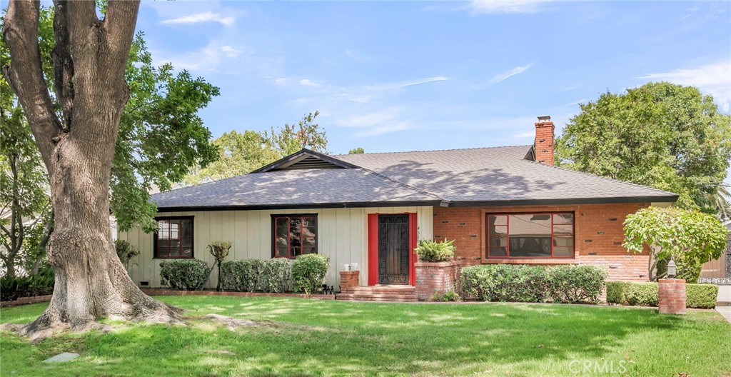 Nestled on one of the most picturesque, tree-lined streets in Riverside’s highly sought-after Wood Streets historic neighborhood, this classic Harry Marsh–built ranch-style home offers charm, space, and timeless appeal. With 3 generous-sized bedrooms, 2 bathrooms, and over 2,100 sq ft of living space on nearly a quarter-acre lot, this residence blends vintage character with comfort. Inside, you’ll find original hardwood floors (with some brand new laminate), a spacious vintage kitchen with real wood cabinetry, a dishwasher, and a cozy nook for casual dining. The indoor laundry room adds convenience (with the original milk delivery door from the 50's), while the large and bright living room easily accommodates both everyday living and formal dining. A separate family room with a fireplace and original built-ins, overlooks the serene backyard, creating the perfect setting for relaxation or entertaining. Central air/heat, pocket doors, and an original sound system in all the rooms too. Step outside to discover a tranquil retreat complete with a gazebo, fruit trees, RV parking, and alley access. The oversized two-car garage features an additional permitted workshop attached to the back side which is ideal for extra storage, a catio, or even a small guest quarters -- offering endless possibilities. The location is unmatched: walking distance to a supermarket, Mt. Rubidoux hiking trails, and Magnolia Elementary School, while just a short drive to Downtown Riverside, the Mission Inn, the Fox Theater, or the Riverside Plaza for shopping, dining, and movies. The canopy of mature trees lends the street a timeless charm, evoking the feeling of strolling through a shaded New England lane, with character at every turn. And for the grand finale—this home offers front-row seats to the Mt. Rubidoux fireworks show every 4th of July, right from your own backyard. A rare Wood Streets gem where vintage charm meets modern possibility -- owned by the same family for 40 years! Time to pass the baton...