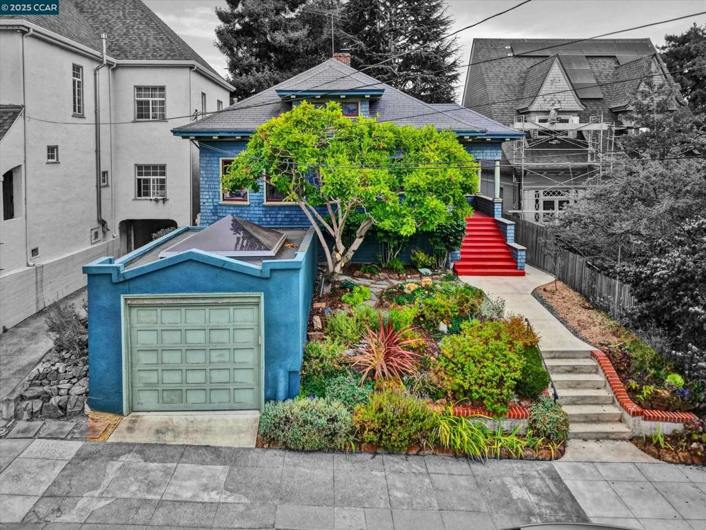 This classic wood-shingled Craftsman blends timeless charm with modern flexibility—just a 7-minute stroll to Lake Merritt. With over 1,600 sq ft of gross living space (tax records show 1,260 sq ft), this 2-bedroom, 2-bath home features a spacious bonus room and a sprawling, park-like backyard under majestic trees. The main level offers a bright living room, formal dining room, Zoom room/home office, two bedrooms, and a kitchen that opens to a peaceful patio deck overlooking the lush backyard. Downstairs, a large bonus room—perfect for a guest suite, creative studio, or third bedroom—sits alongside a full bath, laundry area, and extensive sub-area storage. Located minutes from Lakeshore and Grand Avenue, enjoy the best of Oakland living: farmers market, Trader Joe’s, cafes, shops, and top-rated dining—all just outside your door.