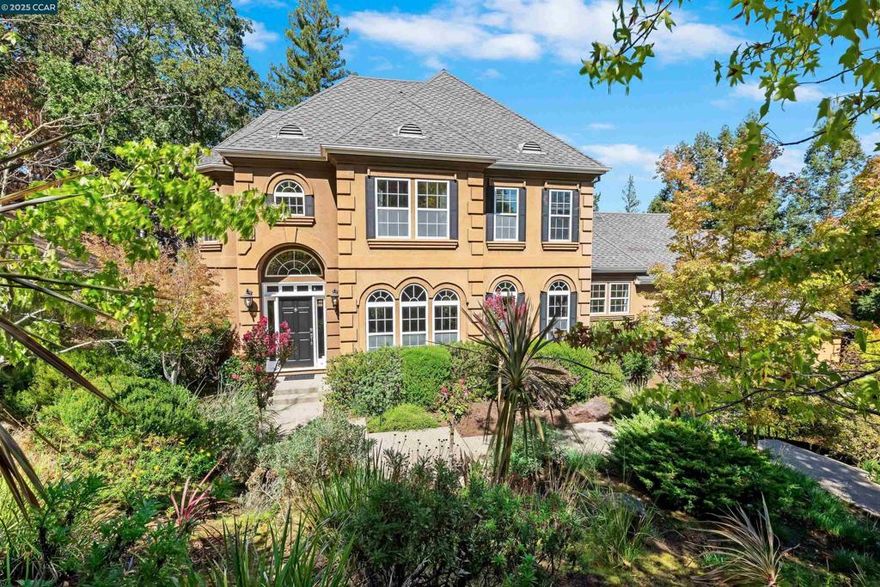 Welcome to 20 Oak Crest Lane, a 4 bed, 3.5 bath home beautifully maintained on the west side of Alamo that offers 3,263 square feet of comfort, style, and functional living.  This residence is perfect for those seeking a relaxed, convenient lifestyle in a peaceful neighborhood, set upon nearly a half acre at the end of a cul-de-sac.  Inside, you’ll find bright and airy living spaces with hardwood floors, a well-appointed kitchen with ample counter space and kitchen nook, a cozy family room that flows seamlessly for everyday living or entertaining, abundant storage space, and a 3-car garage. A main level en suite is an ideal guest room plus light-filled den/office. Upstairs, the primary suite features a private bath, balcony, and generous closet space, while additional bedrooms offer flexibility for family, guests, or a home office.  Outside, enjoy a low-maintenance yard with a patio area ideal for outdoor dining or quiet evenings along the wooded surroundings. Located close to local schools, parks, shopping, and easy freeway access, this home provides the perfect combination of comfort and convenience. 20 Oak Crest Lane is ready to be your next home.