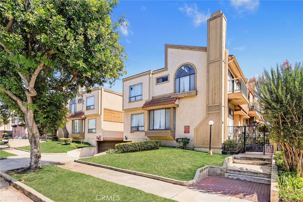 This well-maintained townhome is nestled in a gated community in the desirable North Alhambra neighborhood just steps away from South Pasadena. Double-door entry opens into a large, light-filled living room combined with the dining room has a cozy fireplace and elegant wood flooring. Upgraded kitchen features granite countertops, updated cabinetry, and a charming bay window. The adjacent breakfast area is brightened by a large window, creating a welcoming space for meals and gatherings. The primary suite boasts cathedral ceilings, a generous walk-in closet, and sliding doors that lead to a private balcony. Two well-sized upstairs bedrooms share a full hallway bathroom with a skylight that fills the space with natural light. A spacious laundry room is located next to the attached two-car garage with direct access. The home is equipped with central air conditioning and heating for year-round comfort. Walking distance to Alhambra Park, which features an Olympic-sized swimming pool, tennis courts, playground, and BBQ area. Enjoy easy access to Target, Costco, restaurants, shops, hospitals, and public transportation.