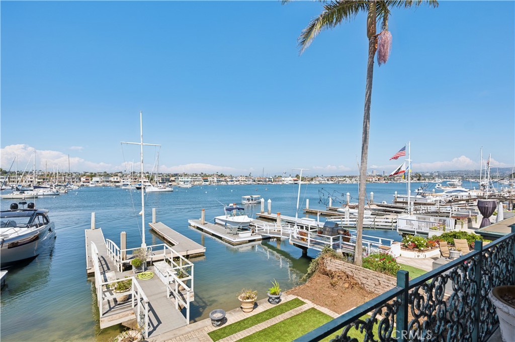 An extraordinary opportunity awaits on the iconic Balboa Peninsula, Newport Beach’s original waterfront neighborhood. Built in the 1950s, this bayfront property offers either a complete remodel or the chance to design and build a dream residence from the ground up. Set on a 35’ x 109’ parcel with 35 feet of waterfrontage, the property features a private pier and dock accommodating vessels up to 55 feet—a true rarity in today’s market. From this vantage point, enjoy sweeping views of Newport Harbor, the West Lido Channel, mountain silhouettes, and the sparkling city lights of Fashion Island. The backdrop is as dynamic as the lifestyle it promises. Here, land and sea come together seamlessly. Swim, sail, paddleboard, or cruise directly from your dock. Wake up to the energy of the harbor with morning crew workouts gliding across the bay, then head across the peninsula to the white sandy beaches of Balboa. The home sits conveniently between the Balboa Pier and Newport Pier, placing you in the heart of the action. Join the locals for daily runs, bike rides, or walks along the world-famous Boardwalk, where the ocean breeze and beach energy create a lifestyle unlike anywhere else. The location places you at the center of it all. A quick Duffy ride takes you to the boutique charm of Lido Village, with its waterfront dining, chic cafés, and luxury shops. Minutes away, enjoy world-class shopping at Fashion Island, effortless access to John Wayne Airport, and the vibrant nightlife of coastal Orange County. This is more than a property—it’s a lifestyle. From quiet mornings with coffee as the harbor stirs awake, to afternoons on the sand, to evenings entertaining as sailboats drift by, 1340 W. Bay Avenue delivers a rare chance to create a generational home in one of Newport Beach’s most coveted settings. This site allows for new construction of a home approximately 3,650–3,750 square feet in size, with a maximum height of 29 feet across three stories.