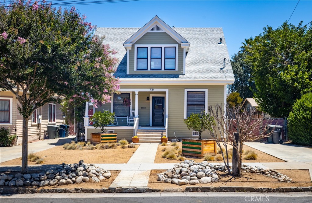 Travel back in time to experience the charm of this historic 4-bedroom, 2-bath 1904 home with R2 ZONING (ADUs anyone?). Situated just blocks from the heart of downtown Redlands, this residence welcomes you with an inviting front porch—perfect for viewing beautiful sunsets or sipping morning coffee. Landscaped trees on the property include boxed orange trees, a Eureka lemon, fruiting Mission fig and a Bacon avocado tree.
Once inside, you’ll notice the quintessential pocket doors separating the parlor from the formal dining room that features a vintage chandelier and a built-in china cabinet. Original architectural details also include high ceilings, picture rail and large bright windows that bathe each room with abundant natural light. The FLOOR PLAN IS GREAT! Downstairs are two bedrooms and a roomy bathroom with pedestal sink and claw-footed tub; upstairs features two more bedrooms, PLUS a SPACIOUS LOFT AREA and an upscale tiled bathroom with similar fixtures. The LOFT is open and features divided spaces that include a sitting room and a TV entertainment area.
Many building improvements have been finished on this home to include:
Brand new James Hardie fiber cement siding wrapping the entire home! This material is known for fire and pest resistance, plus weather resistance, LOW or NO maintenance. YES! EARTHQUAKE BRACED with new footings. YES! House has five new insulation layers in walls, floors and attic that vastly improve home efficiency. Comfort is guaranteed with TWO virtually silent LENNOX CENTRAL HEAT/AIR SYSTEMS. YES! A new 240-amp electrical panel that is electric car ready. YES! Restored original double-hung windows that conveniently open and close. Roof, plumbing and electrical were all replaced. There are a few more cosmetic items for the next homeowner, but the big jobs have been completed.
Enjoy the best of both worlds: timeless craftsmanship and a prime location just moments away from Redlands’ many popular restaurants and specialty shops. Nearby seasonal attractions include the Redlands Bowl, the Redlands Bicycle Classic and numerous market events. This is your opportunity to own a piece of history in one of the community’s oldest and most sought-after neighborhoods!