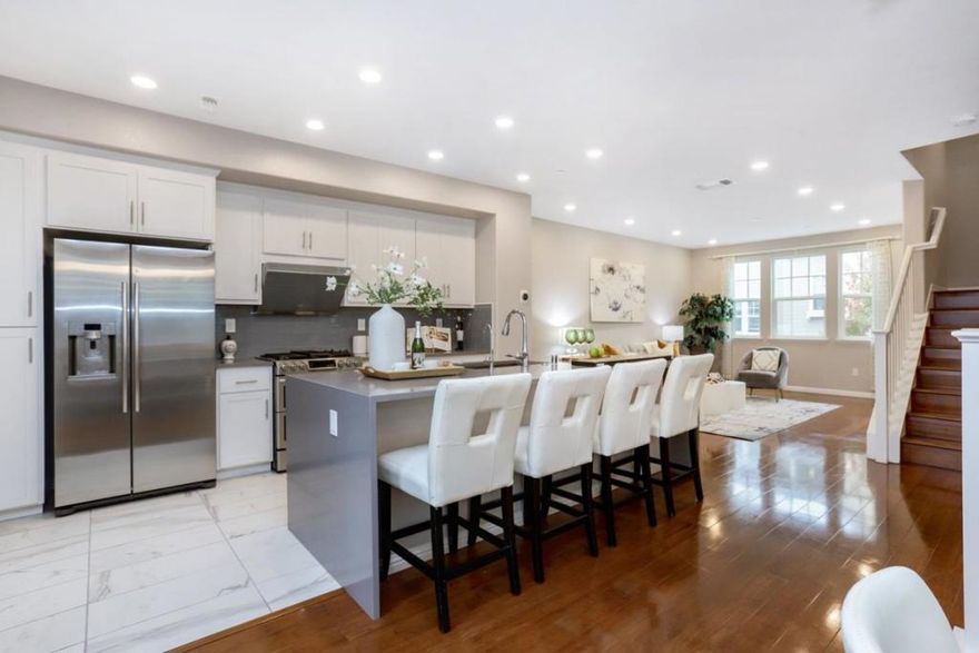 Welcome to this gorgeous 7-year new End-Unit townhome nestled in the highly desirable Radius community. Experience the perfect blend of comfort and convenience in this bright and open-concept home. Features 4 bedrooms, 3.5 bathrooms and 1,904 sq ft of living space. The spacious living and dining area with abundance of natural light and a private balcony, creates a warm and welcoming atmosphere. The gourmet kitchen boasts with quartz countertops, designer backsplash, huge center island, premium cabinetry, and high-end stainless-steel appliances. Spacious master suite features a luxurious ensuite bathroom with dual vanities, a large walk-in closet, elegant light fixtures, and separate bathtub & shower. Convenient ground-level bedroom with a full bath, ideal for guests, home office. Attached 2 -car garage with ample guest parking. Excellent location: walk or bike to VTA Light rail, Caltrain, downtown Mountain View, and major tech companies (Google HQ, Microsoft, Linkedln, Synopsys, Samsung, etc.).Easy access to Hwy 237/101/85 and central expressway. Top-rated Mountain View schools: Mountain View High and new school Jose Antonio Vargas Elementary. Newly constructed Pyramid Park nested in the community: playgrounds, dog parks, spot courts and BBQ area. Low HOA dues ($341/month).