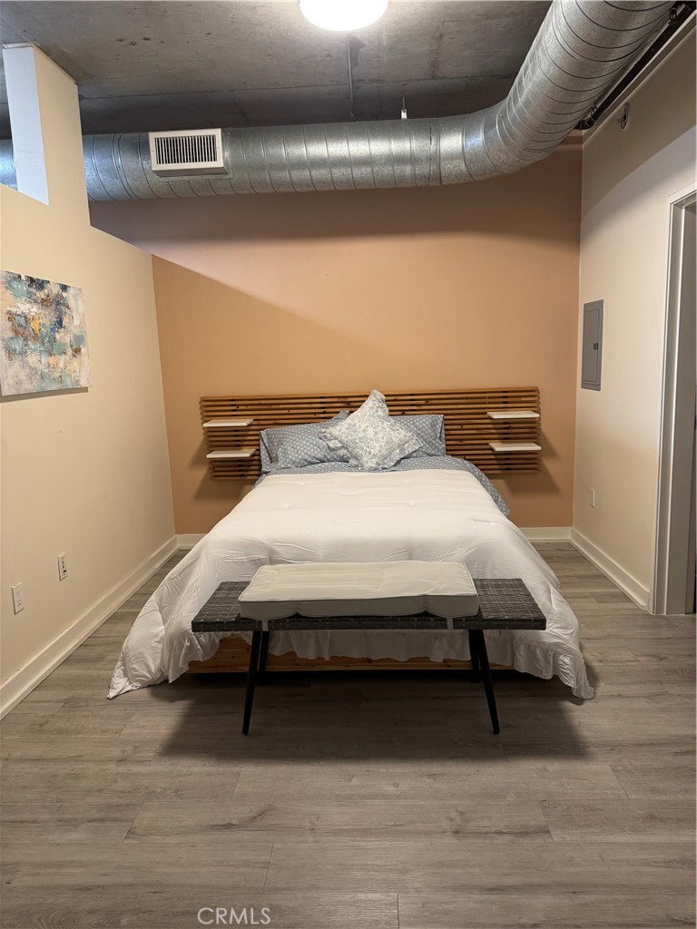 Beautifully home at the Market Lofts locate Downtown LA South Park district. Built in 2006, this modern loft boasts light floor to ceiling windows, wood floors and exposed concrete high ceilings. Open floor plan with views of the interior courtyard. Owner remodel new Contemporary counter tops with white cabinetry in kitchen and bathroom. Washer/dryer located inside the unit. Spacious walk-in closet. Relax on your balcony to enjoy your private oasis. The Walk Score is 95! One huge parking space included. Modern community features include 24/7 security, fitness center, BBQ area, swimming pool, community room with a full kitchen, private screening room with wine fridge and kitchenette. Live in close proximity to Wholefoods, LA Live, Staples Center, Metro station, Macy's, FDIM, USC, Ralph's, shopping, restaurants, entertainment, art galleries, museums, and much more. This is LA urban life at its best! Price is included all staging furniture. buyer just need