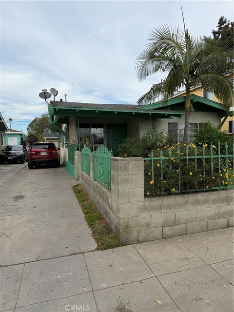 Photo of 1445 W 58th St, Los Angeles, CA 90062 (MLS # IN26042624)