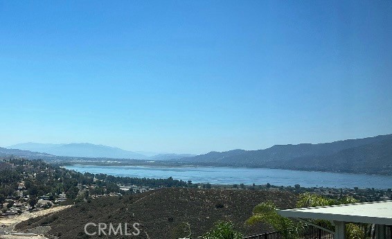 LAKEVIEW! On the unique Ridgeline, located in the highly sought-after Alberhill Ranch Community. Experience breathtaking lake, mountains and city light views from this exceptional 5 Bedroom and 3 full bathroom home with ensuite downstairs. From the moment you arrive, you are welcomed by a gorgeous, fully completed landscaped yard. The finished front and backyard areas make this outdoor oasis enjoyable ready.
The striking custom front door sets the tone for the elegance found throughout the home. Step inside to a warm and inviting open floor plan, enhanced by 9-foot ceilings and beautiful custom laminate light woodgrain flooring that flows through the main level into a bedroom and full bath. This flooring is also in the primary bedroom and loft upstairs.
The chef’s kitchen is a standout, featuring premium stainless steel Whirlpool Gold Series appliances, a 4 door Samsung refridgerator and front load LG washer and dryer. The kitchen features sleek quartz countertops, while all bathrooms are adorned with elegant marble surfaces. A spacious walk-in pantry includes a large window, and recessed lighting with dimmers throughout the home creates a warm, inviting ambiance.
The outdoor space is truly a private retreat—perfect for entertaining or relaxing. Enjoy a covered patio for shade while enjoying the views, a stylish firepit table for cozy evenings all framed by incredibe city light views.
As part of the Alberhill Ranch HOA, you'll have access to a resort-style pool, splash park, and a clubhouse available for private events.
Lovingly maintained by the original owners, this home also includes SOLAR PANELS to maximize energy efficiency. Discover a lifestyle of comfort, luxury, and incredible scenery.
