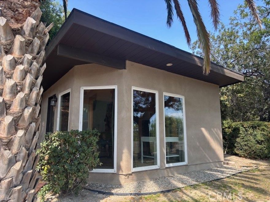 BEAUTIFUL FURNISHED SINGLE 1 BEDROOM WITH DETACHED STUDIO/OFFICE/LIVING ROOM WITH GREAT VIEWS IN A PARK-LIKE PROPERTY FOR RENT.  IT'S LIKE A ONE BEDROOM GUEST APARTMENT BUT WITH A SEPARATE LIVING ROOM (APPROX. 600 SQ. FT.).  FURNISHED AND WITH OWN SEPARATE ENTRANCE.  COZY, SPACIOUS SPACE WITH A CORNER KITCHENETTE/WET-BAR WITH CABINETS FOR STORAGE.  IT HAS DIRECT ACCESS TO LAUNDRY AND FREEZER.  UPGRADED BATHROOM, WOOD FLOORS AND RECESSED LIGHTING.  SEPARATE ROOM WITH GREAT VIEWS AND HAS A LIT, PAVED WALKWAY, ONCE USED AS A RECORDING STUDIO WHICH MAY BE USED AS AN OFFICE/RECREATION ROOM/ART STUDY..... A GREAT PLACE FOR CREATIVE PEOPLE.    HIGH CEILINGS WITH CEILING FAN, 8' BAY WINDOWS AND DOOR, RENTED WITH SOFA, COFFEE TABLE, DESKS BERBER CARPET, AIR CONDITIONER , HIGH CURTAINS PARKING IN DRIVEWAY.  CLOSETS AND LOTS OF STORAGE SPACE.  BREATHTAKING VIEWS OF THE VALLEY.  TRIPLE PANED WINDOWNS FOR ANOTHER 300 SQUARE FEET ROOM.  ASSIGNED PARKING IN DRIVEWAY AND CLOSETS FOR LOTS OF STORAGE SPACE.  LUSH LANDSCAPING AND NESTLED IN A TRANQUIL NEIGHBORHOOD IN WEST HILLS.  THIS IS A MUST SEE!