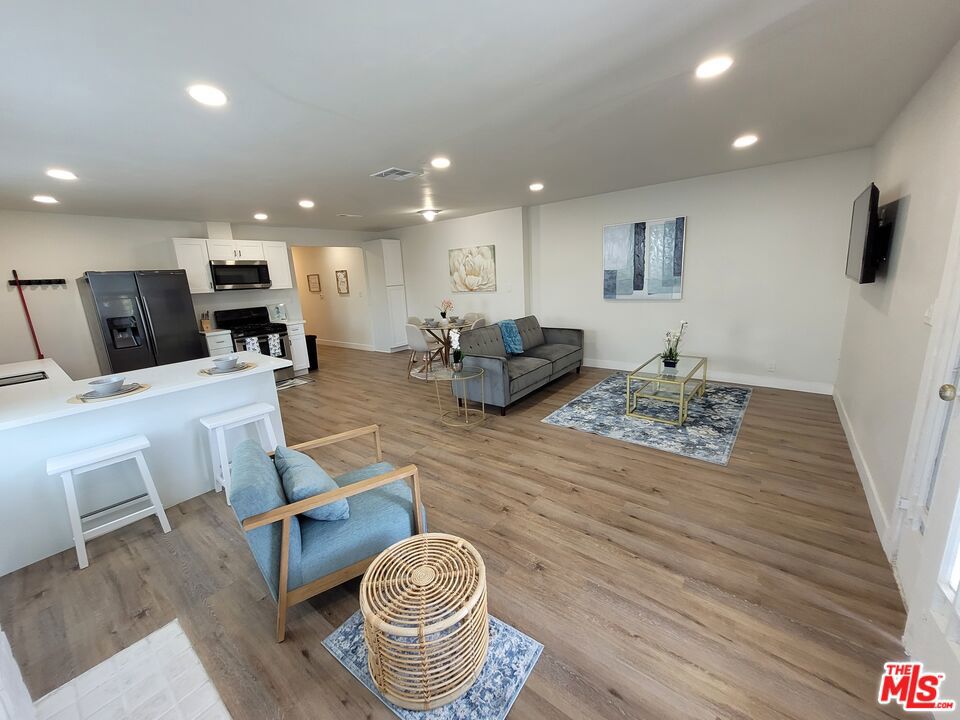 Exceptional opportunity to acquire a beautifully remodeled and fully stabilized Spanish-style duplex with plans to build up to two additional units. Situated on a quiet street in desirable Park Hills Heights, this property offers convenient access to LAX, Downtown LA, and the local beaches. The first unit is a spacious 2-bedroom, 1-bathroom residence encompassing approximately 1,177 square feet. It features a well-designed floor plan with a large living room, formal dining area, full kitchen, and two generously sized bedrooms with walk-in closets. Recent upgrades include dual-pane windows, new flooring throughout, custom kitchen cabinetry with Corian countertops, a fully remodeled bathroom, washer/dryer hookup and fresh interior paint. The primary bedroom provides direct access to the backyard. The second unit is a recently renovated 2-bedroom, 2-bathroom unit with approximately 1,100 square feet. This unit showcases an open-concept layout, new dual-pane windows, solid wood kitchen cabinetry with Corian countertops, new flooring throughout, two upgraded bathrooms, and updated interior paint. A rare blend of turn-key condition, upside development potential, and a prime location make this an outstanding investment opportunity. Live in one and rent the other or add units to maximize long-term value.