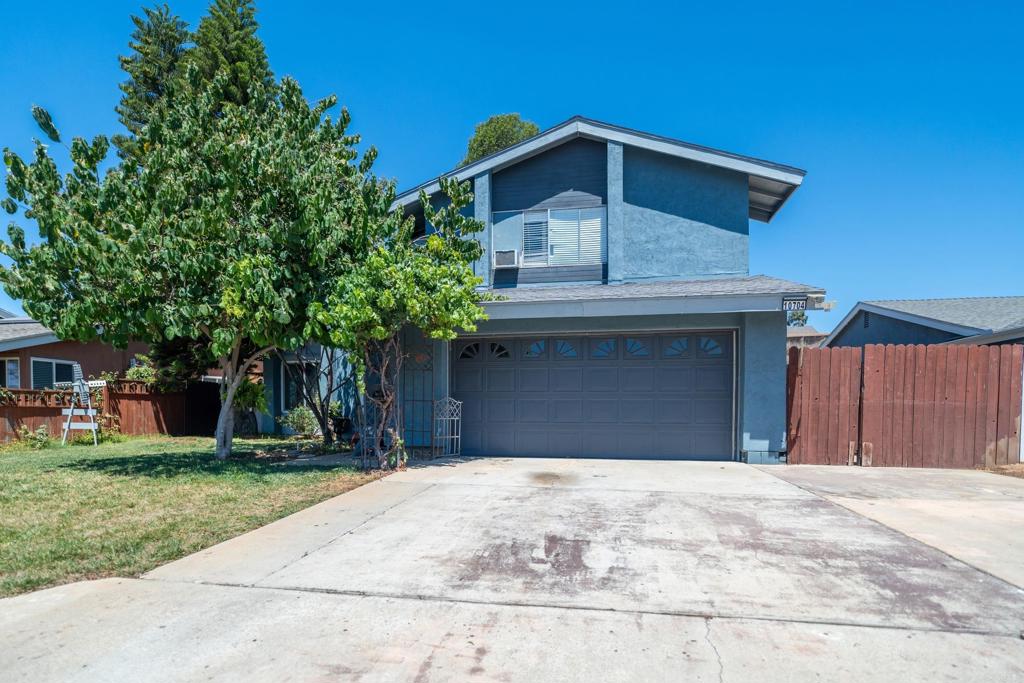Discover the potential of this welcoming 4-bedroom, 2.5-bathroom home nestled in a desirable Santee neighborhood. Offering 1,652 sq. ft. of living space, this two-story residence features paid-off solar for energy efficiency and peace of mind. The heart of the home is the kitchen with granite countertops, which flows seamlessly into a spacious dining and family room area—a perfect setting for gatherings and everyday living. The thoughtful floor plan also includes a living room with a fireplace, a downstairs bedroom and half bath, ideal for guests, a home office, or multi-generational living. Upstairs, you’ll find three additional bedrooms and two full bathrooms, providing plenty of room for family and flexibility. While the home is move-in ready, it also presents a wonderful opportunity to add your personal touch and style with a little updating and TLC. Step outside to a nice-sized back patio, perfect for entertaining or relaxing outdoors. Two oversized storage sheds remain with the home, offering endless possibilities for hobbies, tools, or extra storage. Situated in a quiet, established neighborhood, this home places you close to parks, schools, shopping, and all the conveniences of Santee living. With its combination of space, solar savings, and potential, this is a home you won’t want to miss!