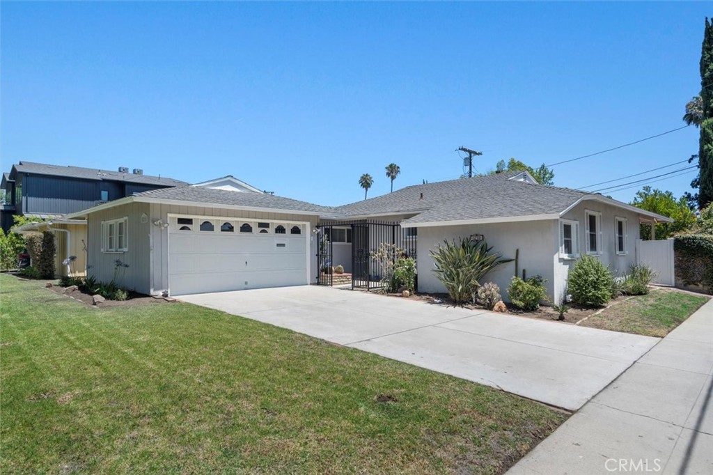 Charming corner-lot home in the desirable Chandler Estates neighborhood offers the perfect blend of comfort, privacy, and convenience. Step inside to a light-filled interior featuring gleaming hardwood floors and an inviting layout designed for both everyday living and entertaining. The home offers four spacious bedrooms and three bathrooms, including two ensuite bedrooms for added flexibility and comfort. Enjoy the expansive backyard, complete with a covered patio ideal for outdoor dining and relaxation, while the securely gated front yard adds a sense of peace and privacy. The attached two-car garage with laundry provides everyday ease. Located just minutes from Louis Armstrong Middle School and Notre Dame High School, this home is perfect for those seeking a prime location in a wonderful community.