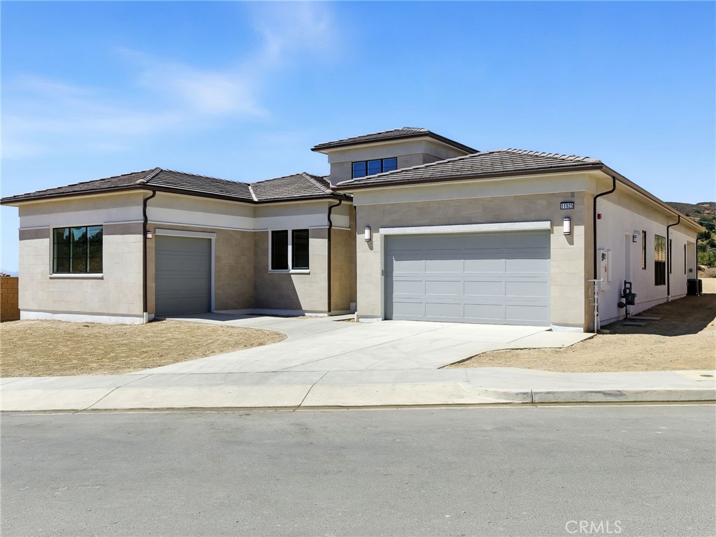 Welcoming to your brand-new Toll Brothers home. Amazing open floorplan surrounded by mountain vistas and breathtaking sunset skies. Last home of its kind with unobstructed vistas and privacy. Attention to detail was not spared. “Model-Like” homesite with 90 Degree multi stacked doors that takes you out to your Luxury Outdoor Living Space, 12 by 8 multi stacked doors from the casual dining and bedroom area into your outdoor oasis. All upgraded quartz counter tops with waterfall feature at Island, beautiful, designed quart full height backsplash, Wolf and Sub-Zero appliances, 24 by 48 travertine tile and nicely upgraded oak plank wood floors in primary bedroom and secondary rooms, a multi-generational suite to entertaining guest with comfort and privacy. All bathrooms have been completely upgraded with upgraded quarts tile surround in primary shower, rain head shower head, spacious walk-in closets, private water closet, dual sinks, all with upgraded plumbing finishes, a separate flex space off the great room, great for a formal dining or additional den. This homesite offers one of the largest and most stunning backyards with over 25,000 sq. ft. of land! Quick move-in. This home is professionally stage and will not include the furniture currently in the home. Come and tour before this home is no longer available at the last and final new community in the desirable mater plan of Porter Ranch!