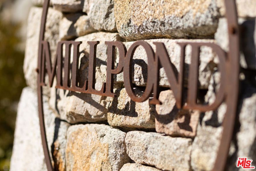 In a prestigious gated community, where luxury homes are already taking shape, lies a new chapter of Lake Arrowhead living.  Welcome to Mill Pond.  Curated for quiet, high-style living and set behind the gated enclave of only 60 homesites, lot #59 offers a rare chance to design a statement residence among emerging luxury builds.  Multi-million-dollar custom homes are already underway, elevating both the aesthetic and the future value of the neighborhood.  The homes rising here are proof that thoughtful contemporary and modern designs are setting the premium tone for what's next.  Community infrastructure includes paved access and underground utilities.  Just minutes to Lake Arrowhead Village dining and markets, SkyPark, hiking and biking trails, and recreation on the lake... all with coveted lake rights. Winter road maintenance and HOA services keep things practical. For those seeking a build-ready home-site in an emerging luxury neighborhood, this lot stands out as one of the few parcels offering a wide, flat building pad.  Bring your architect and imagine a glass-and-timber retreat that frames evergreens by day and starry skies by night.  With just a handful of opportunities left behind the gates, Mill Pond is where new construction, privacy, and mountain ambiance meet.   Shown by appointment.