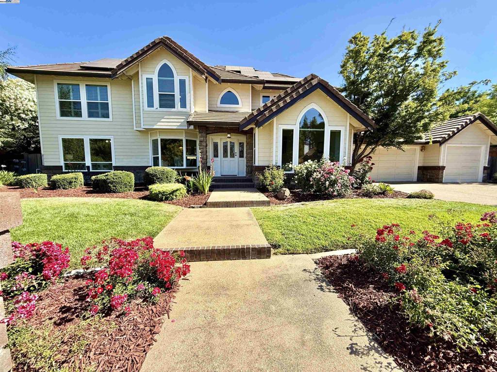 Exceptional Custom Home in Prime Livermore Location! Welcome to this stunning custom home nestled at the end of a peaceful cul-de-sac, featuring a private backyard oasis with a sparkling pool and relaxing hot tub. This spacious and thoughtfully designed home offers five generously sized bedrooms, including a convenient downstairs bedroom and full bathroom, ideal for guests or multi-generational living. Gorgeous wood flooring flows throughout the main living areas, adding warmth and elegance. Enjoy meals in the formal dining room or gather with loved ones in the inviting living room and expansive family room. The large, well-equipped kitchen is perfect for cooking and entertaining, offering ample space for family and friends to come together. Upstairs, you’ll find three additional bedrooms and a luxurious primary suite with elegant updated bathroom. Step outside into your resort-style backyard, where mature landscaping frames a glistening pool, spa, and multiple patio areas, ideal for outdoor dining, entertaining, or simply relaxing in total privacy. Three-car garage plus side-yard access gives you extra storage space. Minutes to downtown and outdoor adventures! This exceptional property is waiting for you!