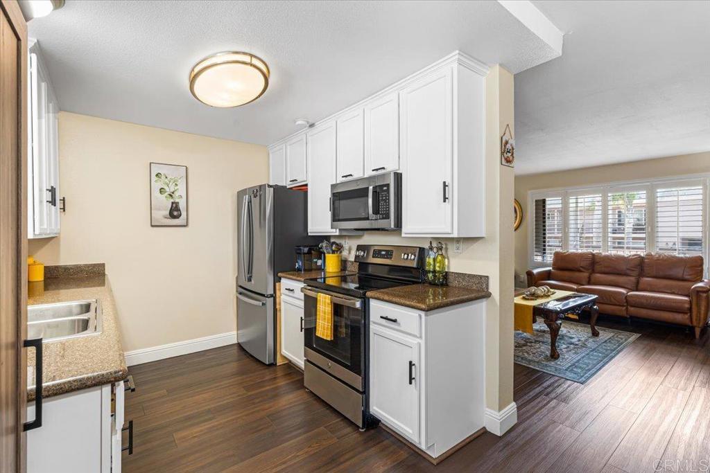 Newer flooring, stainless steel appliances, and window coverings, 1 detached garage, and 1 uncovered parking spot - Discover comfort and convenience in this updated 2 bed, 2 bath condo in the gated Las Palmas community. Perfect for first-time buyers, this second-story home features a bright living room with newer vinyl plank flooring, an upgraded kitchen with stainless steel appliances, and a private balcony for relaxing outdoors.Spacious bedrooms with ample closets and refreshed bathrooms provide both style and function. Enjoy one uncovered parking space and one detached garage, community laundry, and peace of mind in a secure setting.Located near parks, shopping, schools, and freeway access, plus minutes from the exciting Chula Vista Bayfront. A cozy, family-friendly home in an ideal location. Schedule your showing today!