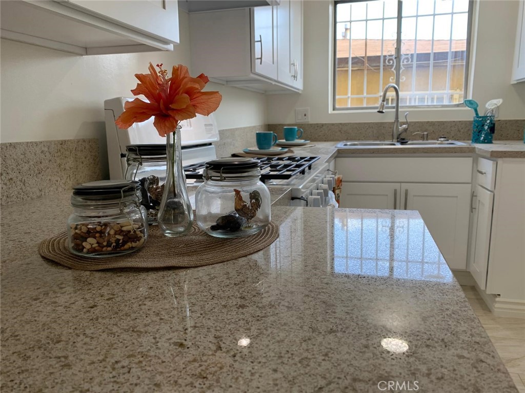 This newly remodeled two bedroom, 1 bath apartment is located on a first floor of a 8-unit apartment building with easy access to parking and laundry facility of the property. Freshly Painted with Laminate floor in your bedrooms. Newly modeled Kitchen, bath and dining area and living room has quartz counter and new cabinets with tiled flooring. This apartment provides stove, onsite laundry facilities and assigned parking, water and trash are paid by the landlord. The property is located in the southbay area of Los Angeles County, close to school, beach, shopping, short distant to the freeway. You will be amazed by the features of this home and our community. Come and make this your home.