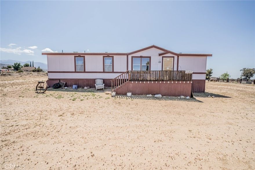 Charming Mobile/Manufactured home designed for comfort and functionality on an expansive 4.7-acre lot. Embrace the peaceful rural lifestyle this property offers, complete with mature trees and a setting that provides both privacy and space for your dream homestead. This home spans 1,404 sqft, offering an inviting split floor plan.The Open Plan Kitchen, features an Electric Range, seamlessly integrates with the dining area to create a sociable setting for family meals and hosting guests. There is an indoor Laundry Room makes for convenience. This home boasts three comfortable bedrooms, including a master suite with a Master Bathroom featuring a garden tub and separate shower—your personal haven for unwinding after a long day. Two additional bedrooms and a second bathroom ensure ample space for family or visitors. Outdoor living is equally delightful with a front porch and back steps, both set to be renewed before closing, offering wonderful space for morning  coffees or evening relaxation. The property also includes several storage sheds and a fenced area for livestock, catering to various lifestyle needs. If you're an enthusiast gardener, the small greenhouse offers the perfect opportunity to nurture your green thumb. For those with an RV or extra vehicles, the RV Parking and ample storage options are noteworthy advantages. Notably, there is a Singlewide on the property, currently utilized for storage, providing added convenience. Positioned in a peaceful community, this property maintains your desired seclusion while still being accessible to nearby amenities. Make this yours today!m