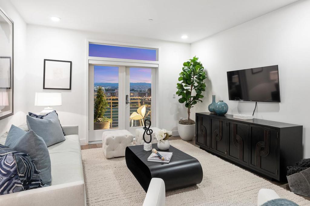 This stunning San Mateo residence has it all! Built in 2016, this contemporary condo offers a spacious and open floor plan with maximum versatility. It offers 3 bedrooms, 2 full bathrooms, approximately 1.200 sq ft of living space, high ceilings, expansive windows and glass doors; all or which form a wondaful great room configuration. The living and dining areas feature gorgeous floor-to-ceiling windows and glass doors leading to a cantilevered patio, flooding the home with an abundance of natural light. The gourmet kitchen features sleek stainless steel Bosch appliances, modern wood flooring, elevated subway tile backsplash, impeccable quartz countertops (we LOVE this kitchen!). The primary en-suite is bright and spacious, with a walk-in closet providing for ample storage. The en-suite also has an expansive spa bathroom with dual sink vanity and a spacious walk-in shower. The unit has Smart lighting wired throughout with each room possessing ethernet capabilities.