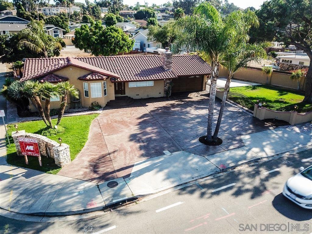 Experience pinnacle custom living in Chula Vista on a sprawling corner lot (13,000+ sq ft) with ADU potential. Enjoy secure gated access and a vast, remote-controlled rear yard for RVs/boats. Inside: travertine floors, gourmet kitchen with custom cabinets, granite counters, stainless built-in appliances, spa baths (jetted tub). Features include a newer roof (2019) and versatile garage conversion, all networked. Prime Chula Vista location: minutes from the $10 BILLION Bayfront redevelopment, Downtown, and 3rd Avenue's dining/culture, with easy freeway access.More than just a residence, this is a lifestyle upgrade, a sound investment in Chula Vista's thriving future, and a blank canvas upon which to paint your dreams. Don't let this rare opportunity slip away. Own a piece of custom luxury with unparalleled potential in a prime location. Prepare to be impressed by this meticulously maintained custom-built residence, a masterpiece of luxury, security, and smart design. Situated on an expansive corner lot exceeding 13,000 square feet, this property offers significant ADU potential for future expansion or rental income. The lot is secured by multiple gated partitions and a remote-controlled gate providing access to a massive rear yard capable of accommodating up to six RVs, boats, or trailers. Step inside to experience true luxury, beginning with timeless travertine flooring that flows throughout the spacious interior. The gourmet kitchen is a culinary dream, featuring granite countertops, top-tier stainless steel appliances, and abundant custom cabinetry. Retreat to the spa-inspired master bath, a true sanctuary with dual sinks, a spacious walk-in shower with invigorating wall jets, and a built-in bench. Guests will appreciate the hall bath's oversized jetted Roman-style tub. This home is designed for the modern age with robust, professionally installed network wiring extending to each bedroom and the garage, all conveniently routed to a hall closet—your ideal central hub for a server or advanced media control. Enjoy enhanced security with custom high-security locks featuring keyless entry from the exterior while ensuring effortless, combination-free exit from the inside for fire safety. Adding to the home's unique charm are thoughtful, custom features like a mirrored wall concealing a secret compartment perfect for stowing TV peripherals, a cleverly integrated pull-out spice rack beside the refrigerator, and ambient mood lighting hidden behind crown molding, all controlled by a dimmer switch. Practicality and peace of mind are paramount, with a new roof installed in 2019, recent heater service, dual exterior clean-outs, and a custom garage conversion offering a versatile space for a home office or gym. Beyond the exceptional features of the home itself, its location offers prime investment potential. Situated just minutes from the transformative $10 BILLION Bayfront redevelopment project, the vibrant energy of Downtown Chula Vista, and the diverse dining and culture of 3rd Avenue, residents enjoy unparalleled access to growth and amenities. Effortless commuting is ensured with easy freeway access just two blocks away. This corner-lot gem offers a rare and compelling combination of luxurious living, exceptional security, and outstanding investment potential. Don't miss this unique opportunity to own a truly remarkable property—why settle for a standard home when you can buy custom?