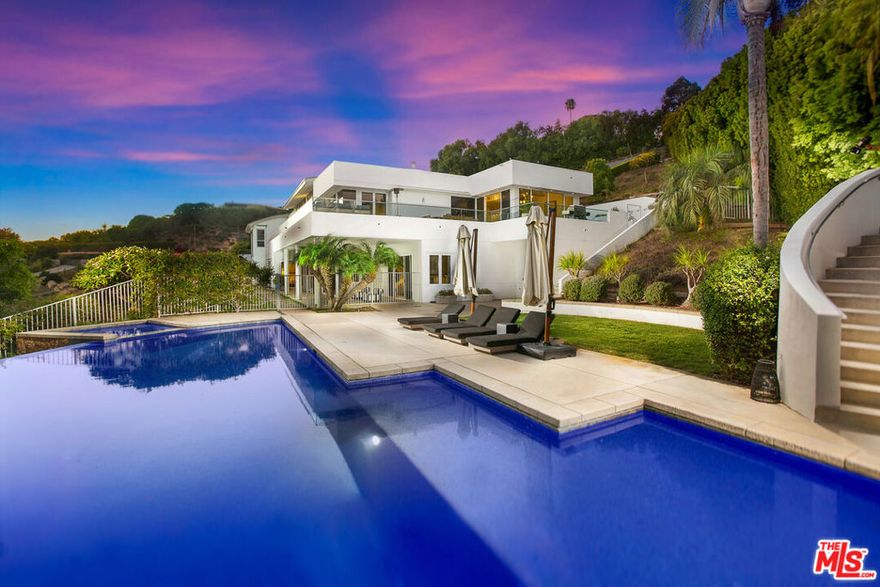 Welcome to your private Malibu paradise  a stunning 6-bedroom, 10-bath estate set on 2.5 acres of lush, landscaped grounds. This gated compound offers the ultimate blend of luxury, privacy, and resort-style amenities, complete with parking for 10+ cars.Surrounded by tropical landscaping and expansive stretches of green grass, this home feels like an exclusive retreat. The backyard is an entertainer's dream, featuring a sparkling pool with a slide, relaxing spa, and a full-size tennis court. Enjoy breathtaking views from every angle and unwind in multiple outdoor lounge areas framed by mature trees, vibrant gardens, and manicured lawns throughout the estate.Inside, you'll find grand living spaces, a state-of-the-art home theater, a private gym, and abundant storage throughout. Each bedroom is generously sized, with the primary suite offering its own private quarters and serene views.Eco-conscious living meets elegance with fully installed solar panels, ensuring efficiency without compromise.Whether you're enjoying family time or simply taking in the Malibu sunsets, this 2.5-acre estate offers everything you could ever dream of  and more.