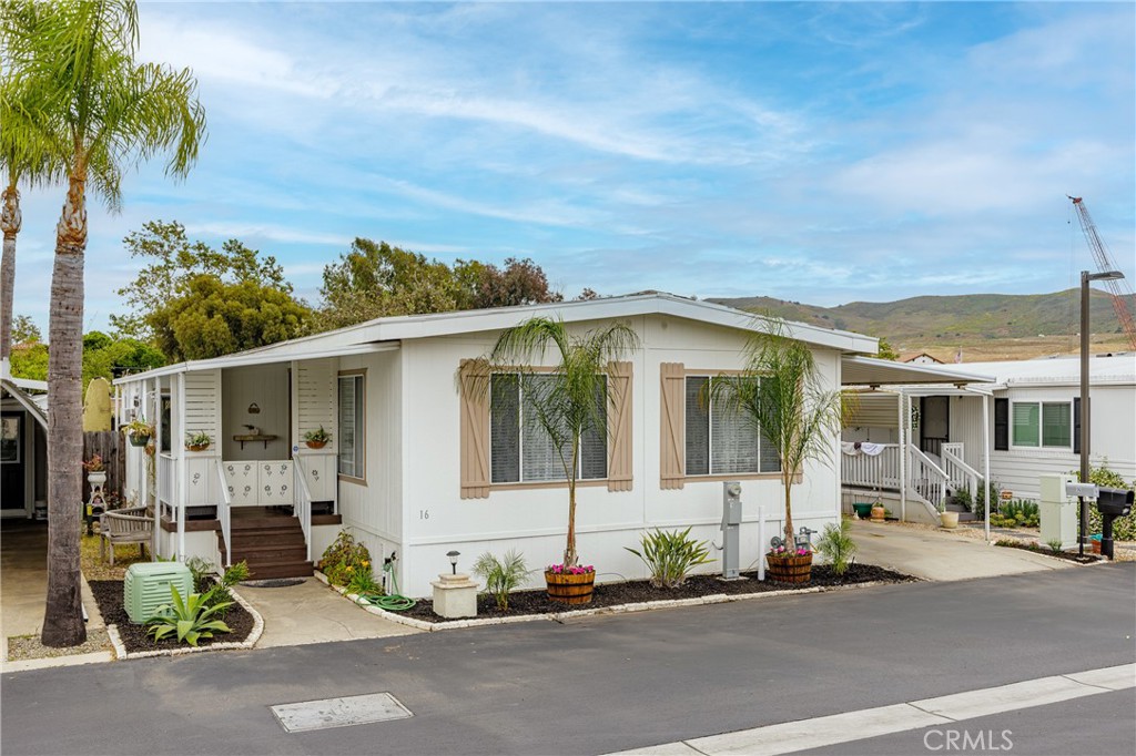Welcome to 32302 Alipaz Street Sp. 16, a cozy 2-bedroom, 2-bath mobile home located in the heart of San Juan Capistrano’s San Juan Mobile Estates. With 1,248 sq ft of comfortable living space, this home features a large living room perfect for relaxing or entertaining. The beautifully updated bathrooms include a spacious bath with a jetted tub. The home comes with a washer, dryer, refrigerator, dishwasher and a NEW heating/AC unit—making daily living easy. Step outside to enjoy a darling front patio and fully landscaped front and backyard spaces. A fully enclosed sunroom off the secondary bedroom gives you a bright and quiet retreat. Most of the furniture is included, so you can move in and start living right away. The San Juan Mobile Estates community is rent controlled by the city and offers a variety of amenities like a pool, spa, billiards room, gym, and banquet facilities. It’s a friendly, family-oriented neighborhood with regular events and activities. Located less than a mile from San Juan Capistrano Metrolink Station, Mission Basilica, and the Los Rios Street Historic District, you’ll have easy access to shops, dining, and beautiful local attractions. Doheny State Beach and Dana Point Harbor are both just a short drive away. This new listing is ideal for anyone looking to enjoy a relaxed lifestyle in one of Southern California’s most charming communities. Don’t miss this opportunity—schedule a tour today and see everything this lovely home and area have to offer.