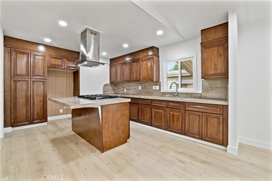 Beautifully remodeled, turnkey single-story home, perfect for first-time buyers seeking comfort and long-term value! From the moment you walk in, you’ll love the open layout with a formal living and dining area featuring new laminate flooring, neutral tones, and abundant natural light. The spacious updated kitchen includes granite countertops, stainless steel appliances, center island, and plenty of cabinet space—ideal for cooking and entertaining. The home offers two spacious bedrooms with a fully remodeled bath, plus a private master suite with walk-in closet and an updated bathroom featuring a walk-in shower. Major upgrades provide peace of mind, including: new HVAC system, new roof, new water heater, all new dual-pane windows, new interior/exterior doors, updated kitchen and bathrooms, and new flooring throughout. The large backyard with a brand-new fence offers privacy and room to entertain, garden, or expand. With all major systems updated, this home is not only move-in ready but also a smart investment with low maintenance and excellent resale potential.