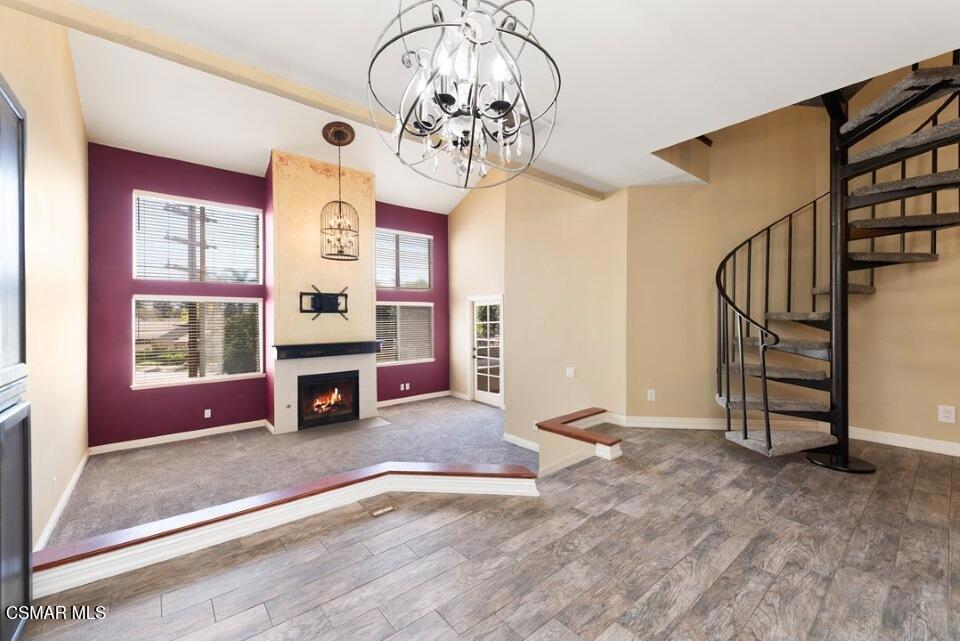Step inside this one-of-a-kind upper-level New York loft-style home, tucked within a secure gated community. With soaring vaulted ceilings, fresh paint and carpet, and a cozy fireplace, this spacious unit blends comfort with striking design.The main suite offers dramatic volume ceilings, a walk-in closet, and a beautifully remodeled bath with custom finishes. Upstairs, a generous loft doubles as a second bedroom, complete with its own walk-in closet plus an expansive workshop and storage area.A chef's kitchen awaits with stainless steel appliances, a built-in vacuum system, and a clever dish-drying drawer--ideal for those who love to cook and entertain. The spacious balcony with dual access extends your living space outdoors, perfect for morning coffee or evening relaxation.Additional highlights include a secure garage with storage closet, assigned parking space, built-ins, and included combo washer/dryer (without warranty).The desirable Sycamore Villas community offers resort-style amenities: sparkling pool, spa, tennis and basketball courts, greenbelt, playground, and available RV parking. HOA fees also cover water, hot water, and more--making life here both convenient and enjoyable.Located near dining, shopping, schools, medical facilities, and entertainment, this home is not to be missed.