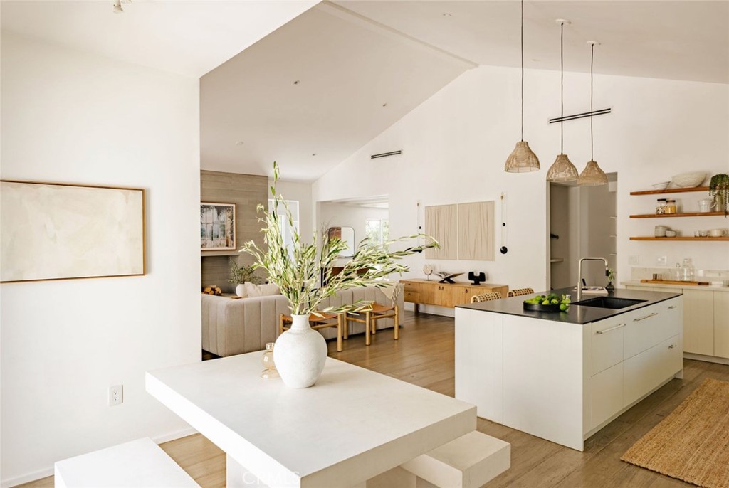 Stunning Modern Farmhouse in Atwater Village – 4BR, 3BA + Detached Studio
Discover a masterpiece by Allprace, nestled on an oversized lot in one of Atwater Village’s most sought-after enclaves. This 4-bedroom, 3-bathroom modern farmhouse, with a 360-sq-ft detached studio, offers 2,567sq ft of bold yet inviting living space, blending dramatic architecture with everyday comfort.
Step through custom Dutch doors into a breathtaking open-concept living, kitchen, and dining area, where soaring ceilings and a board-formed concrete fireplace create a striking first impression. Built-in shelving and cozy window seats add charm, while French doors in the living room seamlessly connect to the front yard. The chef’s kitchen is a dream, boasting a Gaggenau refrigerator, Bertazzoni range, sleek custom cabinetry, and leathered stone countertops. A spacious family room with French doors opens to the outdoors, perfect for entertaining.
The primary suite is a serene retreat with vaulted ceilings, a large walk-in closet, and a spa-like ensuite bath featuring a freestanding stone resin tub. A second master suite, ideal for guests, offers a walk-in closet, private backyard access, dual marble vanities, and a skylit bath. Two additional bedrooms share a stylish hallway bath with dual vanities, contemporary tilework, and a skylight.
Just steps from the North Atwater Bridge with direct Griffith Park access and a short stroll to Proof Bakery, Dune, and McCall’s Meat & Fish Co., this home blends luxury, lifestyle, and prime location. Don’t miss this Atwater Village gem!
"Most Renovation in year of 2018"