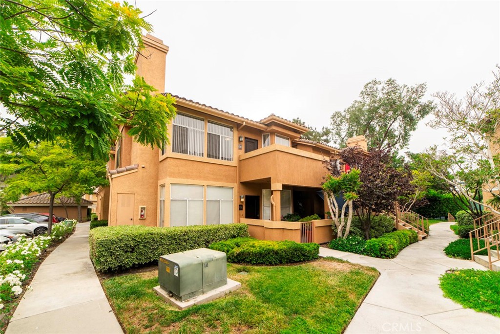 Beautiful GATED Tuscany luxury end unit condo with view of greenbelt. Community offers 2 pools, spa, tennis, fitness center, business center. Floor plan offers 2 master suites on separate wings. Luxurious interior features many custom upgrades, including stainless appliances, 5" base molding, Walk to library, theater and shopping. Attend award winning schools. Unit offers private laundry hooks or association laundry facility. Turnkey!
