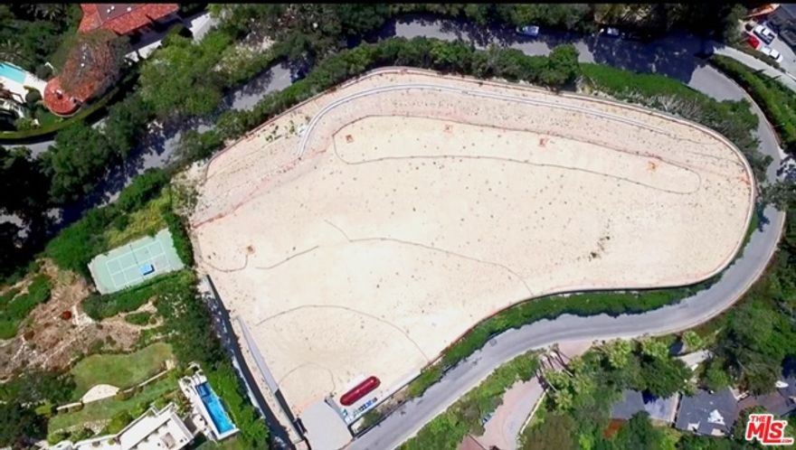 Located within the ultra prestigious East Gate of lower Bel-Air, 800 Stradella Rd. is a breathtaking approx. 2 acre promontory site, overlooking awe-inspiring jetliner views from downtown to the Pacific Ocean. This one of a kind development opportunity offers plans and ready to issue permits for a world class 30,000 Sq.Ft. architectural marvel designed by internationally renowned S&#195;&#402;&#194;&#163;o Paulo, Brazil based Studio MK 27.