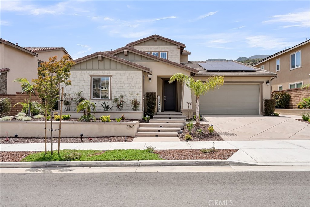 Welcome to the luxurious gated community of Sierra Bella in Corona! This pool home provides beautiful views of the Inland Empire, as well as high-end upgrades throughout. The entry sets the tone for the rest of the home. Natural light shines through and illuminates the white shiplap walls and helps light your way into the open living space. The oversized living room is central to the home and leads into both the kitchen and the downstairs primary bedroom suite. The kitchen is a chef’s dream! Including a central island, the kitchen has plenty of counterspace, cabinetry, high end appliances, step in pantry, and built in refrigerator. The dining room is open to both the kitchen and living room and leads to the backyard through the slider. 3 bedrooms are located on the first floor of the home including the aforementioned main bedroom suite. This tranquil owner’s suite is large and has peaceful views of the backyard pool and lights. The suite includes a bathroom with dual sinks, walk in shower, soaking tub, and large walk-in closet. The other two guest bedrooms on the other side of the first floor are spacious and have a full bathroom nearby. Lastly downstairs, you have a full laundry room. The stairs in this home include upgraded bannisters that help to make the space feel more open as well. Upstairs there is a massive loft, guest bedroom and full bathroom, as well as a covered back patio that overlooks the backyard. The backyard space has been thoughtfully designed with your entertainment in mind! The large pool and spa are the main attraction with peaceful spillways and fire feature to complete the right ambiance for your evening get-togethers. Relax and unwind while you lay out on the oversized daybed. Enjoy a formal dinner with family and friends under the gazebo or escape the sun in the covered California room just outside the home. This home provides peace and serenity with a touch of luxury! Located near the 91 Freeway and Fastrak entrance, this home is a commuter's dream!