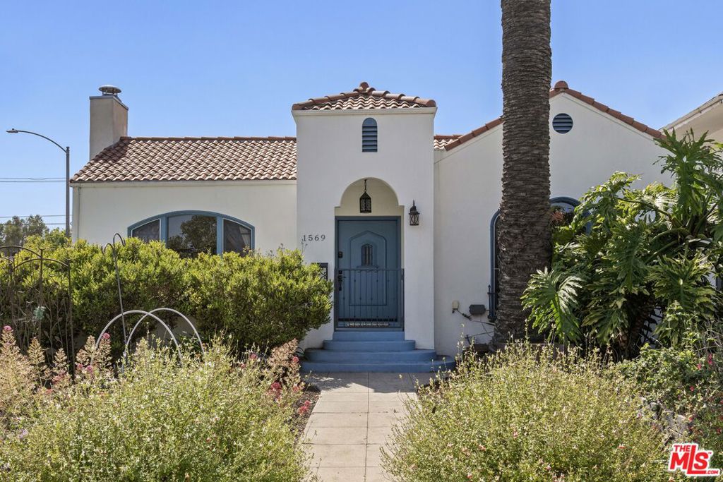 On a spacious corner lot, your dream opportunity in highly desired Picfair Village has arrived. A duplex with a single-family home of 3 bedrooms + office and 1.5 bath plus a luxe 1 bedroom/1 bath apartment over the 3-car garage. Enjoy the glory of this stellar updated Spanish home. The front corner lot has been designed with California drought tolerant ornamentals and a fruit and vegetable garden that include yuzu, navel oranges, cherry trees, nectaplum, guava, peach, lime, Meyer lemon, tangelo and Valencia oranges. Through the front door you are met with soaring 11 ft ceilings and a wood burning Batchelder fireplace flanked by French and Palladian windows. Hardwood floors and period details are found throughout. Off the living room is a stunning patio to sip your morning cup. The generously sized formal dining room features a mint condition glass chandelier from the 1920's and French doors that open up to a south facing patio, providing spectacular natural light. Perfect for entertaining. The main house features three generously sized bedrooms sharing a main bathroom with period tile. The dazzling kitchen with clay tile, built-ins and stainless-steel appliances, is large enough for any cook to hone their inner chef. Off the kitchen is a breakfast room currently being used as an office. Lastly there is a huge laundry room and statement powder room with dreamy wall paper. The vision of the home is to bring the outside in and every side of this home features a private outdoor area that supports entertaining. The guest unit/apartment is as charming as the front house, with many period details included. The house has a 3-car garage with three separate bays, one including an EV charger. Ideally located near Miracle Mile's Museum Row, Culver City (Sony, Apple, Amazon and more) and Cedars-Sinai, Picfair Village has a strong community vibe and is minutes from several local cafes and coffee shops. A rare opportunity to own a soulful, sophisticated home that embodies the architectural richness and spirit of old Los Angeles with all the comforts of today. Edibles in the opulent garden include: blueberry, raspberry, strawberry, rosemary, sage, thyme, oregano, culinary lavender. Other upgrades include: premium energy efficient windows, EV charger, earthquake retrofitted, central HVAC in both units, chimney has been completely rebuilt. Come and make this your Shangri-La in the heart of Mid-City! Attention investors and developers, this is a prime location in a desirable neighborhood, and is a great opportunity to develop a 4-story, 15-unit apartment building due to the (Q)R3-1-0 zoning. Development may be by right (buyer to verify).